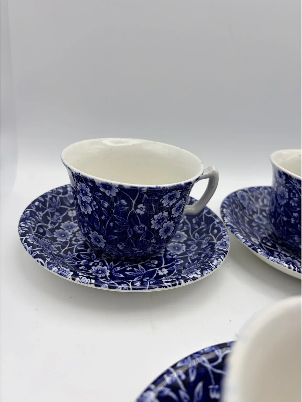 5 vintage sets of cups and saucers. Blue on white 1968 England.